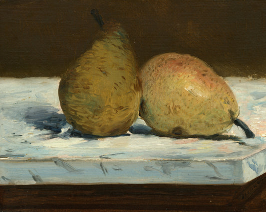 Two pears on a table with a dark background
