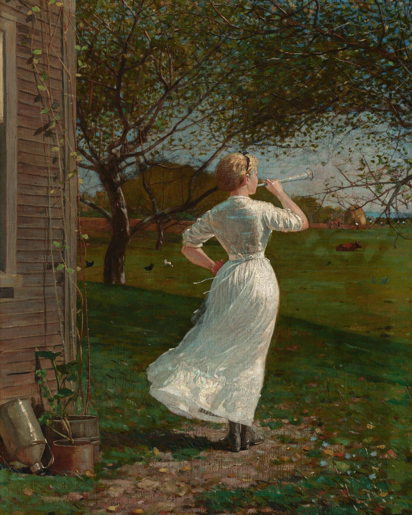 Woman in a white dress standing in a garden, blowing a horn.